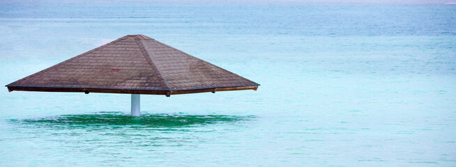 A parasol on the water at the Leonardo Club's private beach. The beautiful Dead Sea © vvvita