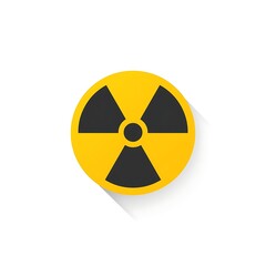 A bright yellow circle with a black radiation symbol in the center, casting a long shadow.