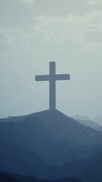 Serene cinematic landscape showing a single crucifix emerging from heavy atmospheric fog, perfect for Lenten reflection and Christian worship visuals