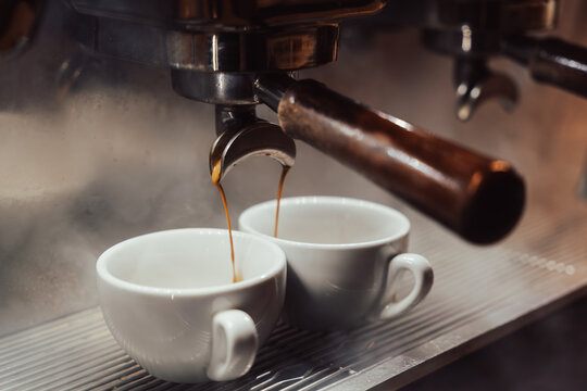Espresso Machine Pouring Fresh Espresso into Cups, Close Up Coffee Brewing