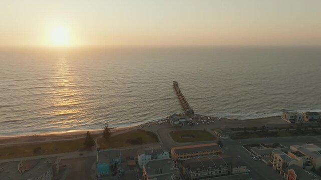 Aerial Drone Shot of Swakopmund Jetty at Sunset Over the Atlantic Ocean, Namibia