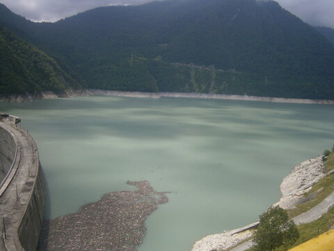 Enguri hydroelectric power plant and artificially dammed river in the middle of the mountains