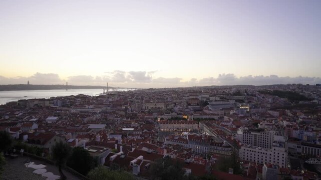 Lisbon, Portugal, elevated sunset panoramic video from Castelo de S&atilde;o Jorge over the historic Baixa district and the Tagus River.