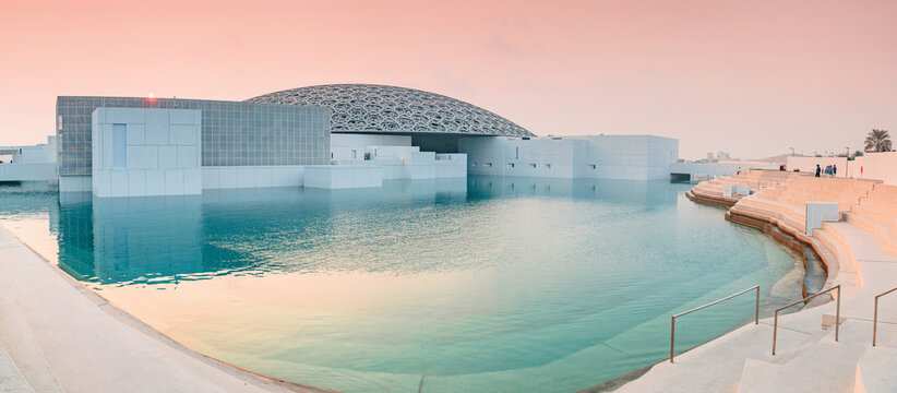 6 December 2025, Abu Dhabi, UAE: Louvre building and water feature on Saadiyat Island, reflecting the surrounding light
