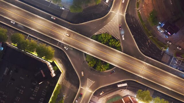 Aerial Night Highway Interchange with Traffic Flow