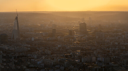 Naklejka premium Paris, France - 03 03 2026: Montparnasse Tower: View of The Triangle Tower building and skyscrapers near Porte de Versailles at sunset from the rooftop