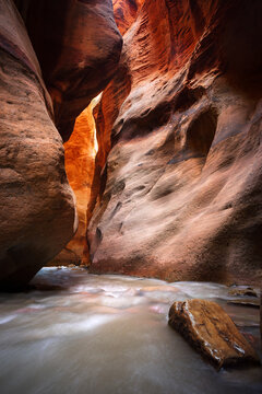 Creek Flowing Through Kanarraville Slot Canyon at sunrise, Zion National Park, Utah, USA