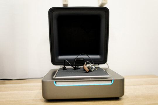 Photograph of an open audiometer, REM or hearing aid analyzer on a table in an audiology clinic.
