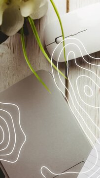 Vertical video: White contour appearing right edge, spreading over trackpad and mouse for focus