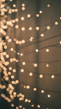 A string of warm glowing lights against a dark background