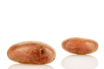 Raw unpeeled pink potatoes isolated on white background, close-up.