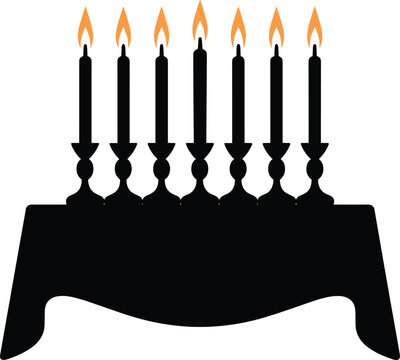 Menorah with seven lit candles in traditional holder