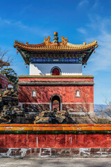 Fototapeta premium A close-up of the Xumi Lingjing Sun Temple at the Summer Palace in Beijing, China. The ornate roof and traditional architectural style showcase China's rich cultural heritage.