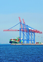 Fototapeta premium Container ship under port crane