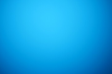 A plain background with a vibrant gradient of blue, creating a sense of depth and visual interest.  © Stock4u2024 
