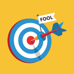 Bullseye target with dart hitting center and fool flag, concept of being fooled or April Fools' Day prank