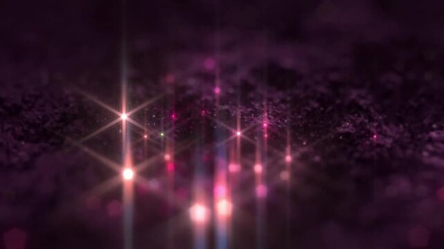 Purple shimmering glitter texture with glowing pink stars and twinkling bokeh light particles motion