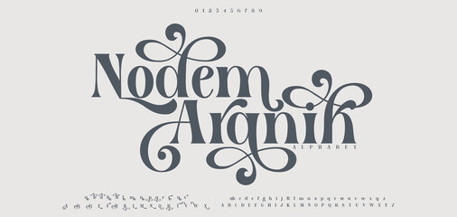 Nodem Aranih typography beauty fashion elegant minimalist serif italic fonts decorative wedding vintage retro logos. Minimal luxury font alphabet logo. Vector illustration © DesignerST
