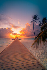 Fototapeta premium Radiant dreamy Maldives sunset beach with pier water villas palm trees vibrant colorful ocean horizon tranquil sky clouds serene summer destination