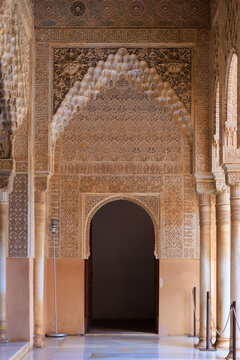the arcade in the  Court of the Lions, The walls and arches are covered in "Sebka" (grid-like) patterns and incredibly detailed muqarnas, Alhambra, Granada, Spain