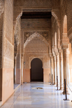 the arcade in the  Court of the Lions, The walls and arches are covered in "Sebka" (grid-like) patterns and incredibly detailed muqarnas, Alhambra, Granada, Spain