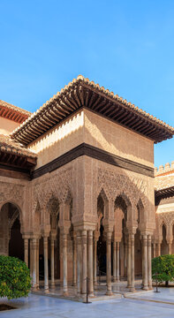the arcade in the  Court of the Lions, The walls and arches are covered in "Sebka" (grid-like) patterns and incredibly detailed muqarnas, Alhambra, Granada, Spain
