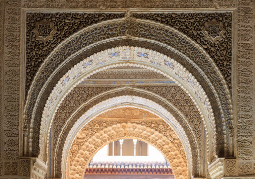 the layers of arches decorated with patterns in Alhambra, Granada, Spain