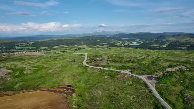 Drone flying over the old Storwartz mining area in R&oslash;ros Norway. The aerial view shows the mining landscape and surrounding nature during bright summer daylight.
