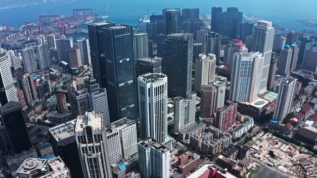 Dalian CBD Skyline with Harbor and Skyscrapers Aerial View