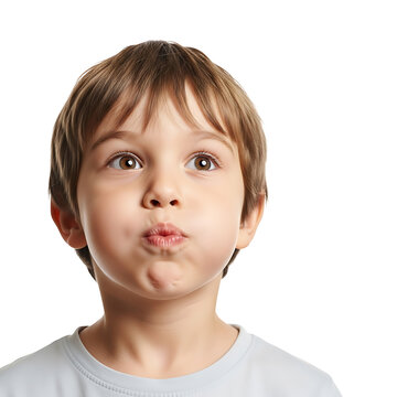 Close-up portrait of a young boy with his lips puckered as if about to blow a kiss