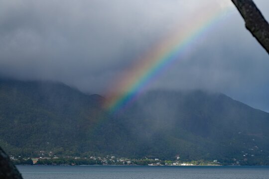 Rainbow over the tropical Beau Vallon Beach in Mahe, Seychelles, on the Indian Ocean