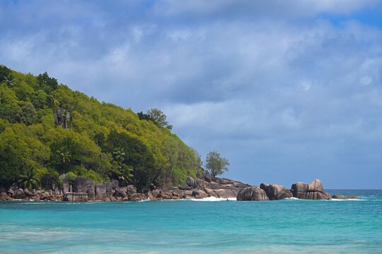 Granite boulders on a deserted tropical beach in Mahe, Seychelles, on the Indian Ocean