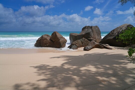 Granite boulders on a deserted tropical beach in Mahe, Seychelles, on the Indian Ocean