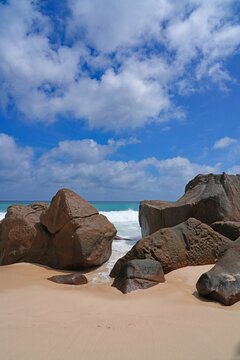 Granite boulders on a deserted tropical beach in Mahe, Seychelles, on the Indian Ocean