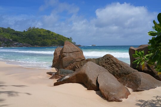 Granite boulders on a deserted tropical beach in Mahe, Seychelles, on the Indian Ocean