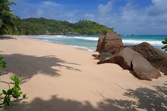 Granite boulders on a deserted tropical beach in Mahe, Seychelles, on the Indian Ocean