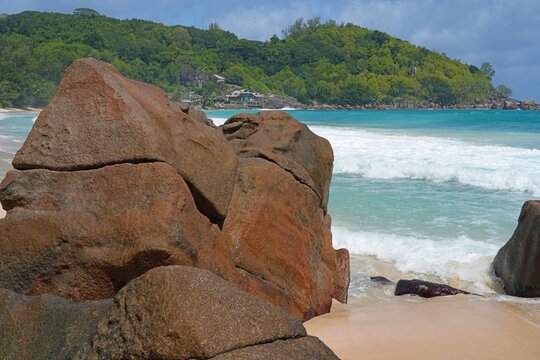 Granite boulders on a deserted tropical beach in Mahe, Seychelles, on the Indian Ocean