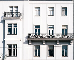 Obraz premium facade of an old building with metal balconies