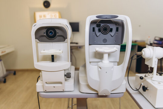 Advanced ophthalmology equipment performing eye examination and vision testing in a modern optical clinic