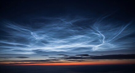 Obraz premium Enchanting Noctilucent Clouds dance across the twilight sky, their delicate luminescence creating a breathtaking and ethereal natural spectacle at the very edge of space