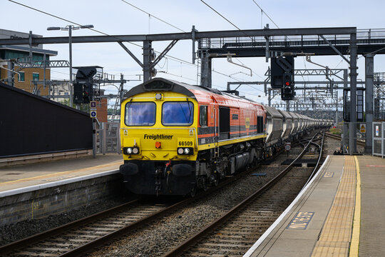 Reading, England, UK - September 9, 2025; Freightliner diesel locomotive hauling freight train approaching