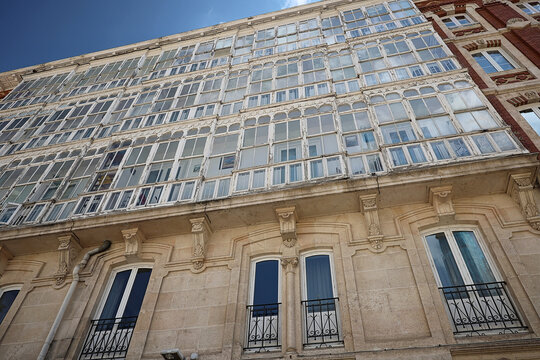 bourgeois house facade with glazed balcony in Burgos, Spain