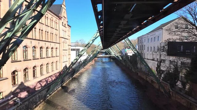 Wuppertal Suspension Railway Above Wupper River and City Street in Wuppertal Germany
