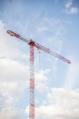 Image of a Work Crane in a Construction with the background of shiny sky