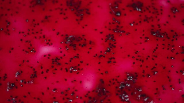 Closeup of shiny fruit jam. Vivid shot showcasing lustrous berry jam in closeup. Magnified image highlighting glossy and vibrant appearance of berry fruit spread