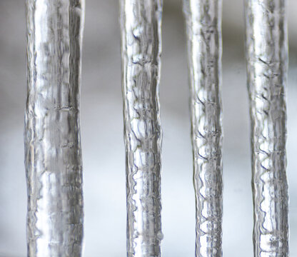 Canada, BC, Delta.  Long icicles outside of a window