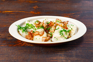 Traditional dish with dumplings and meat served on a plate