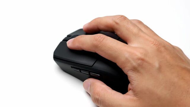 Sequence of an adult male hand clicking a black computer mouse on a white background. Digital interaction for business, e-commerce, or gaming. Using a modern peripheral device