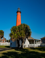 Color image of the old lightkeepers quarters and the brick Ponce Inlet Lighthouse on Florida's Atlantic Coast