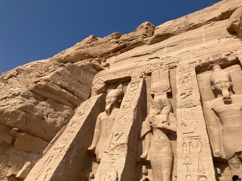 ASWAN, EGYPT - NOVEMBER 8, 2025: Panoramic view of Abu Simbel Temple complex with monumental statues of Ramses II and desert landscape in southern Egypt